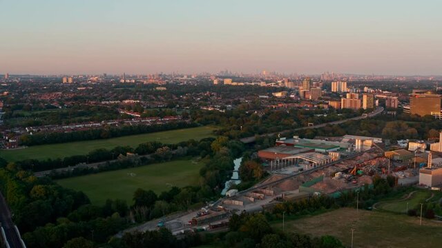 Dolly forward drone shot towards Central London skyline from the West at sunset