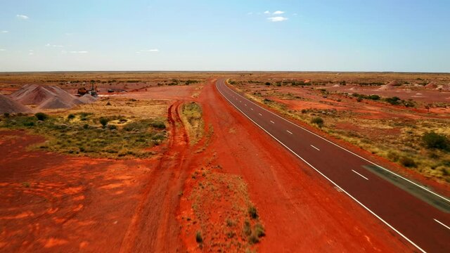 Empty Road Of Stuart Highway Between The Grassland In Northern Territory In Australia. aerial