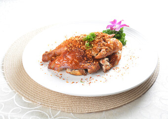 roasted bbq golden crispy whole chicken meat with crackers in white background asian halal menu