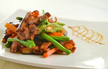 stir fried mixed vegetables with meat in spicy samba chilli sauce in white background asian halal menu