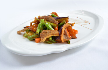 stir fried mixed vegetables with meat in spicy samba chilli sauce in white background asian halal menu