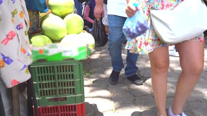 Latin american street market. Feet of people in street market