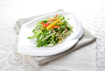 stir fried slices green dragon vegetables in soy sauce in white background asian halal menu