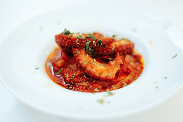 Greek Style Octopus Dish Sitting on a Restaurant Table