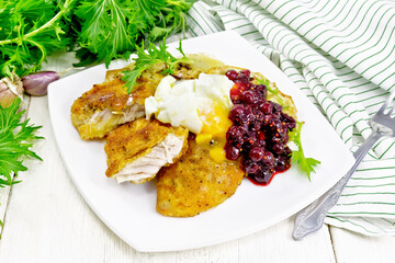 Turkey breast with cranberry sauce on board