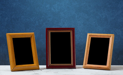 frames on table, blue wall