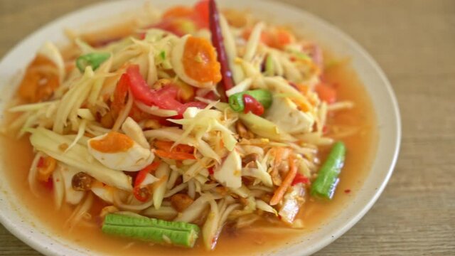 Som Tum - Thai Spicy green papaya salad with salty eggs - Asian food style