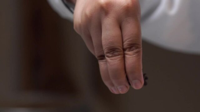 spreading chocalate chip choco chip on cream  with hand slow motion .
