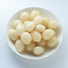 Rambutan in a white plate on a white background