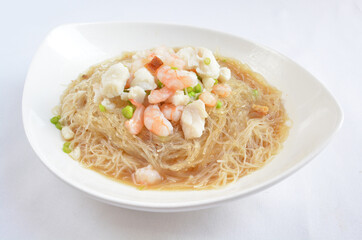 braised seafood bee hoon thin rice noodle in opeh leaf in white background asian halal menu