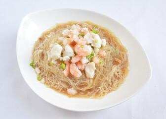 braised seafood bee hoon thin rice noodle in opeh leaf in white background asian halal menu