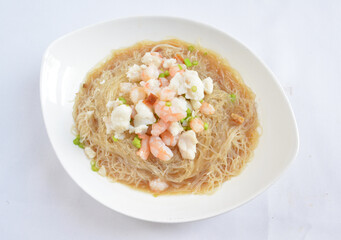 braised seafood bee hoon thin rice noodle in opeh leaf in white background asian halal menu