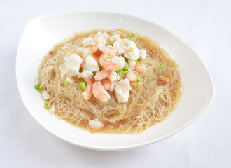 braised seafood bee hoon thin rice noodle in opeh leaf in white background asian halal menu