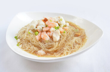 braised seafood bee hoon thin rice noodle in opeh leaf in white background asian halal menu