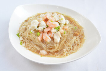 braised seafood bee hoon thin rice noodle in opeh leaf in white background asian halal menu