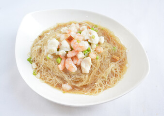 braised seafood bee hoon thin rice noodle in opeh leaf in white background asian halal menu