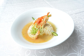 premium braised thread vermicelli noodle with big tiger prawn seafood in stock soup in white background asian halal menu