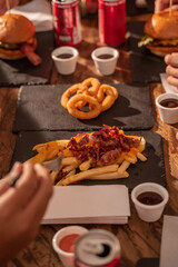 hands of a reunited family eating