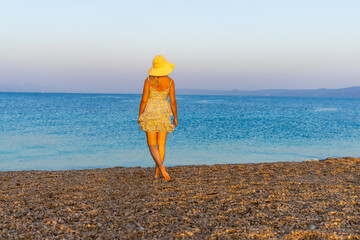 Girl on the Zlatni Rat beach near Bol town, Brač Island, the Adriatic Sea, Croatia