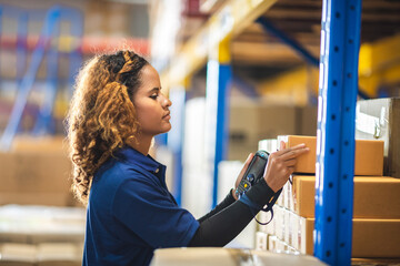 African American woman are work with business distribution inventory in warehouse factory, female...