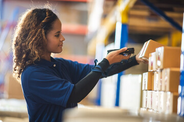 African American woman are work with business distribution inventory in warehouse factory, female people working in safety occupation job for shipping industry manufacturing - obrazy, fototapety, plakaty