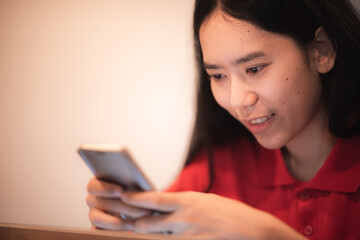 professional business person holding smartphone and using to work with communication technology, smart mobile phone, people smiling and happy at modern office