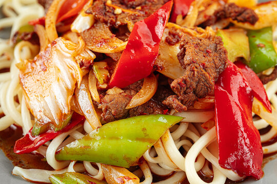 Asian uyghur dish guiru lagman noodles on a wooden background