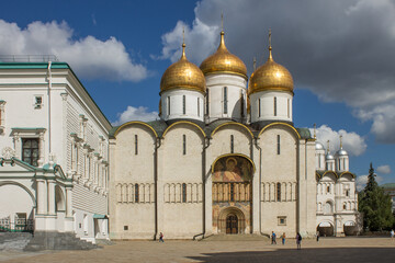 Cathedral of the Assumption of the Most Holy Theotokos with golden domes in the Kremlin on Cathedral Square on a sunny summer day in Moscow Russia