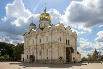 The Archangel Cathedral in the Kremlin with golden domes shining in the sun on a clear summer day in Moscow Russia