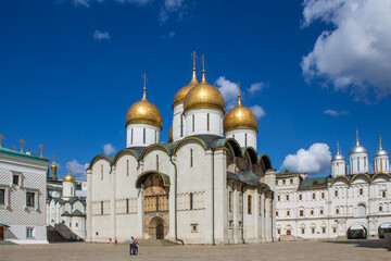 Fototapeta na wymiar Cathedral of the Assumption of the Most Holy Theotokos with golden domes in the Kremlin on Cathedral Square on a sunny summer day in Moscow Russia