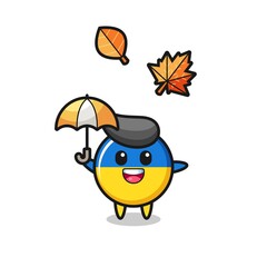 cartoon of the cute ukraine flag badge holding an umbrella in autumn