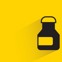 bottle with shadow on yellow background