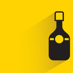alcohol bottle with shadow on yellow background