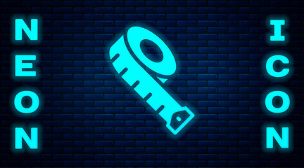 Glowing neon Measuring tape icon isolated on brick wall background. Tape measure. Vector