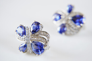 earring with big blue tanzanite and white diamonds around, jewerly shop, pawnshop concept