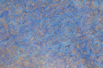 blue crayon doodles on recycled paper background texture