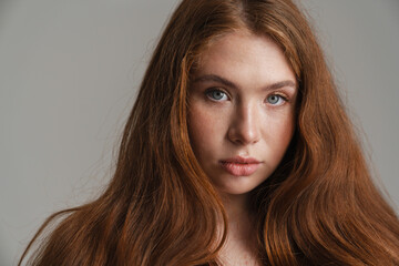 Close up of a young white woman with long red hair