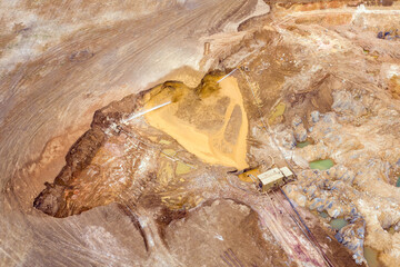 Gold mining. Flushing the rock with a powerful jet of water using pumps