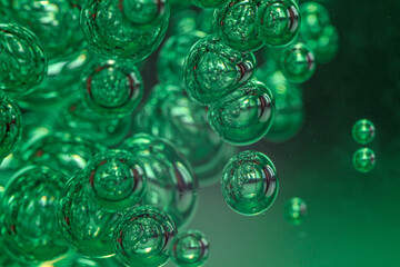 Lots of air bubbles in the green liquid. Macro image.