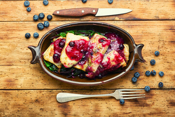 Baked pangasius fish with blueberries
