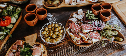 Beautifully decorated snacks on the banquet table before the holiday. Catering food and drink on wedding party