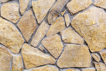 Stone wall as a background or texture. Part of a stone wall, for a background or texture
