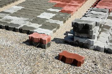 Multi-colored paving slabs laid on the basis of sand