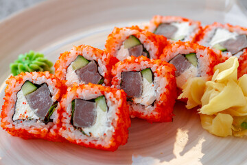 California roll with tuna Japanese cuisine in plate on gray table
