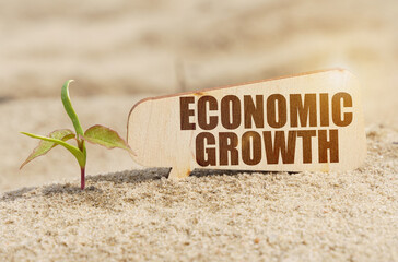 Near the sprout there is a plate with the inscription - economic growth