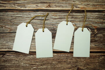 Flat lay White Blank Tag on wooden background
