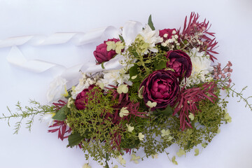 wedding bouquet on a car on a white background