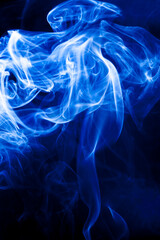 Motion blue smoke on black background.
