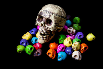Model of human skull on black background.