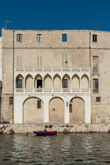 Strolling along the streets of Monopoli. Boats and places of magic